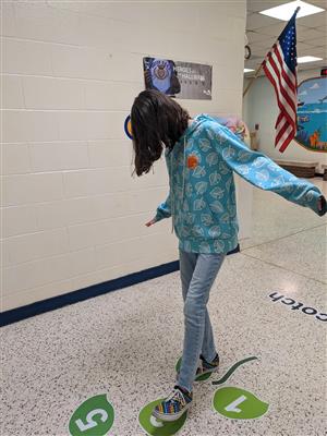 Student trying out hopscotch.